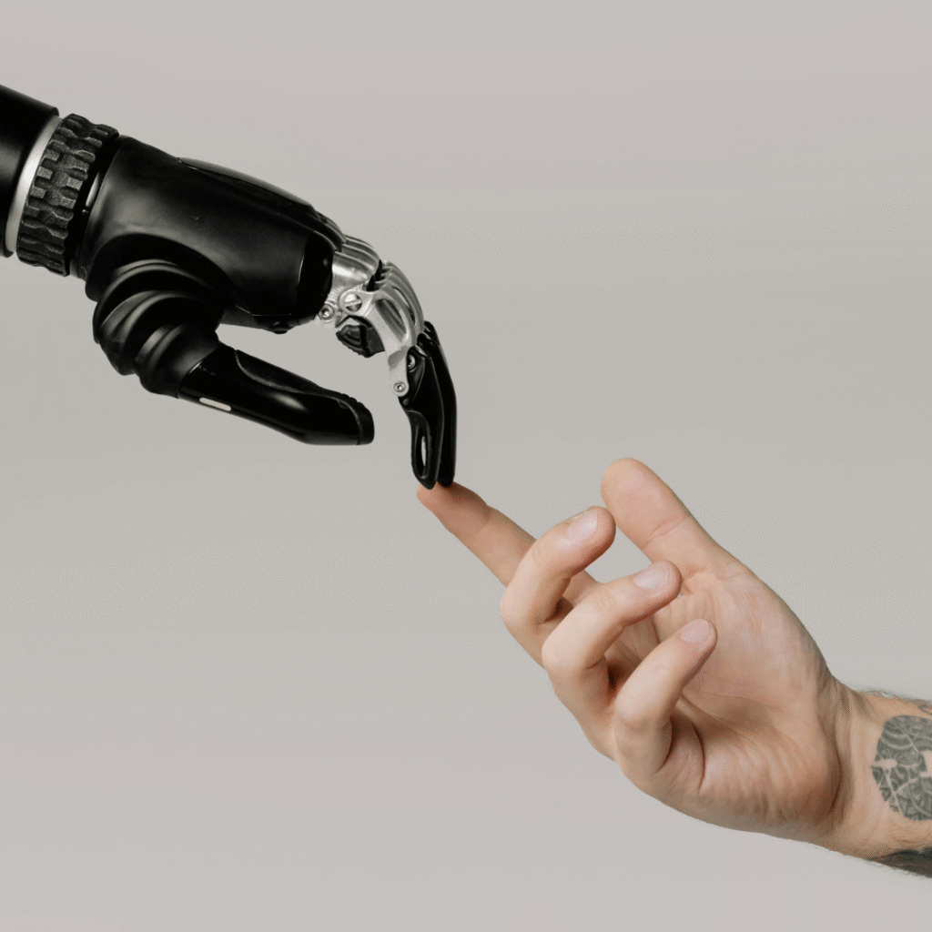 AI-powered automation for tattoo studios—robotic hand connecting with tattooed human hand