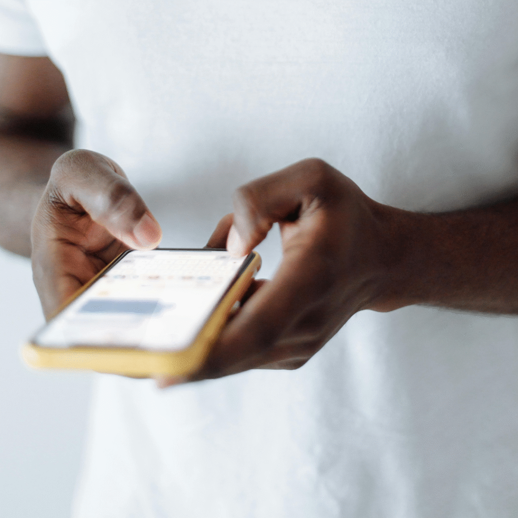Tattoo client using smartphone to message and book via LucentDesk tattoo booking app