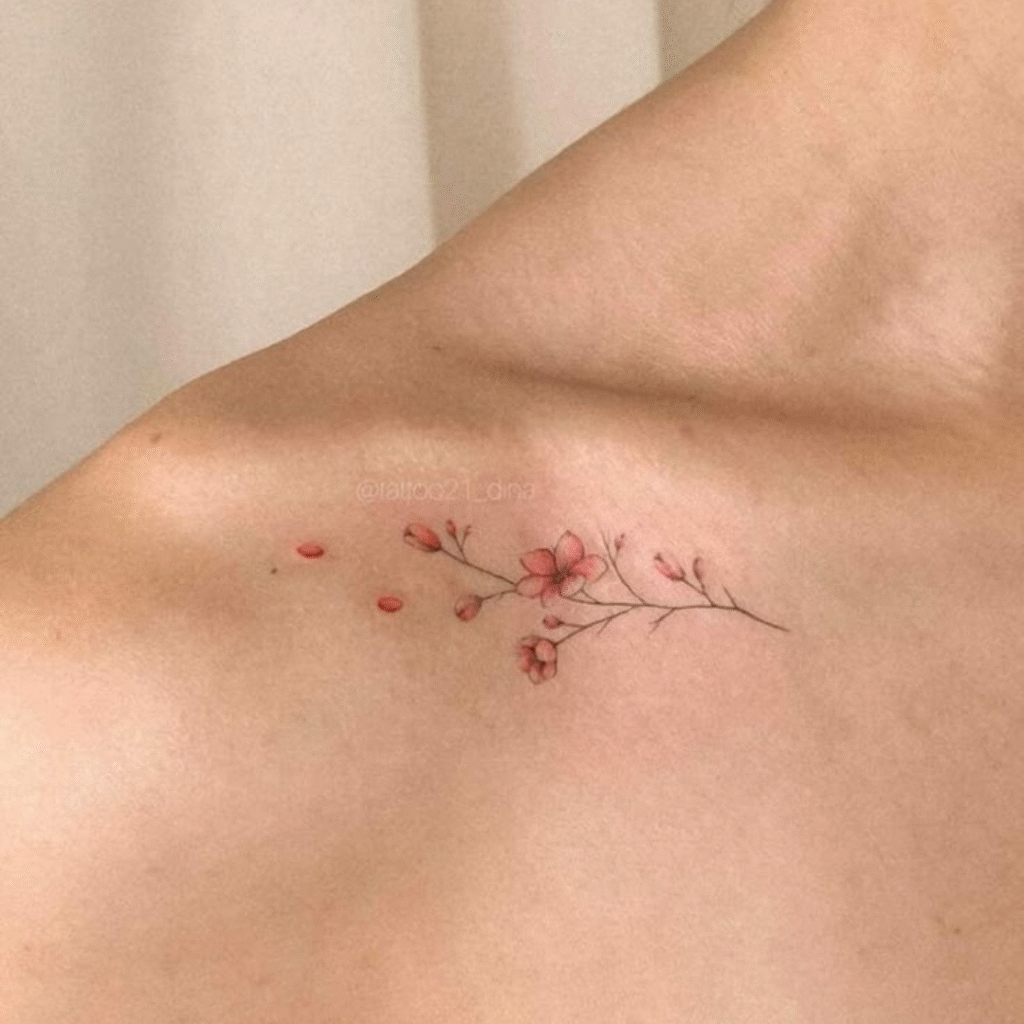 Tiny tattoos marketing with delicate fine-line floral tattoo on shoulder