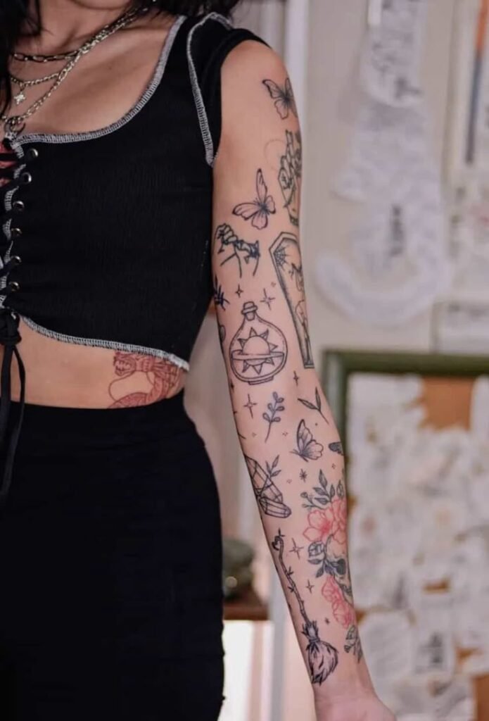 Sticker sleeves tattoos on arm with eclectic icons including jukebox, flowers, and glasses