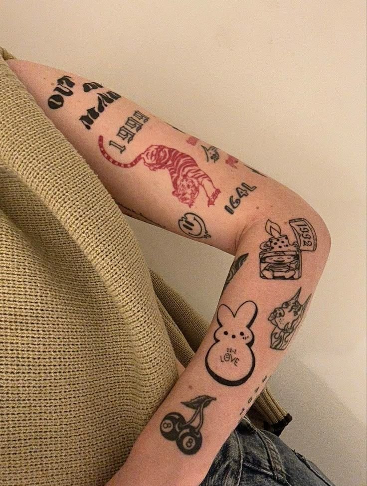 Sticker sleeves tattoos patchwork style with red tiger, lettering, and playful symbols
