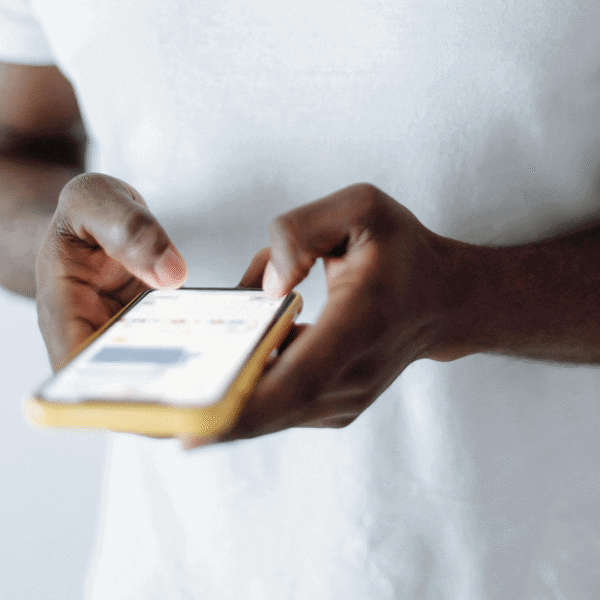Tattoo client using smartphone to message and book via LucentDesk tattoo booking app