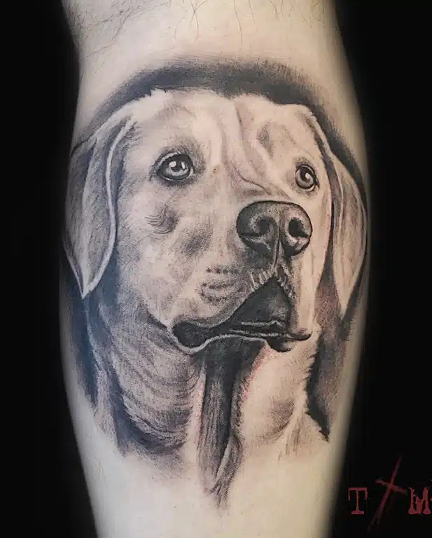 black and gray realistic labrador retriever portrait tattoo on leg